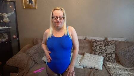 Playing with Dildo in blue swimsuit and pantyhose