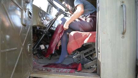 Girl in high heels red boots tames the monster truck from the USSR