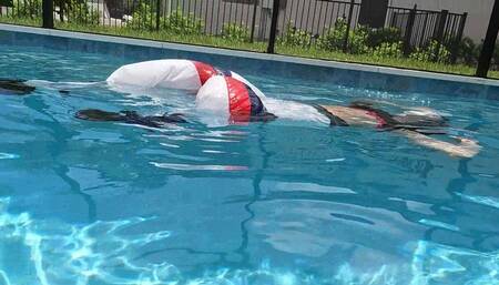 Kilo Swims in Two Nylon Outfits