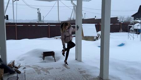 girl in high heels is glued to a cardboard box and can’t get it off her shoes, she’s annoyed by it