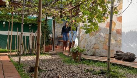 Kahina and Kalinda crush grapes with their brown boots