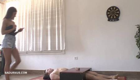 While Natasa is on the phone, the slave has an orgasm