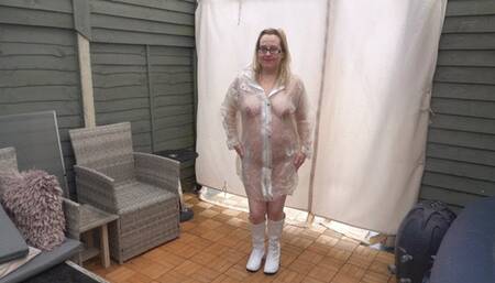 Naked wearing Plastic Transparent Raincoat and White PVC Boots in the freezing Cold outdoors