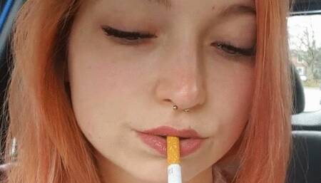 Sweet redhead smoking in car