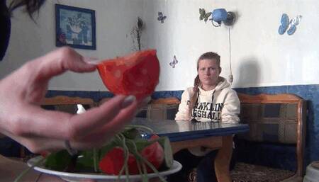 girl with vegetables pinching nose Fso