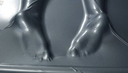 Tickling and flogging feet in a gray latex bed