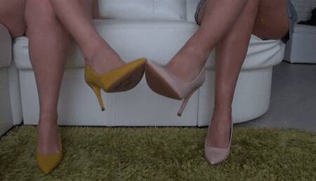 Flirting beautiful legs in colored high heels Aa