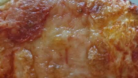 Eating and digesting a very greasy Italian pizza - Margherita with cheese and pizza with sausage 4K