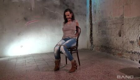 Linet Slag's Dom plays with her massive tits while she is tied to a chair