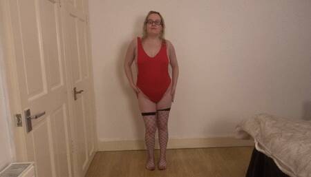 Dancing Striptease in red leotard and fishnet stockings