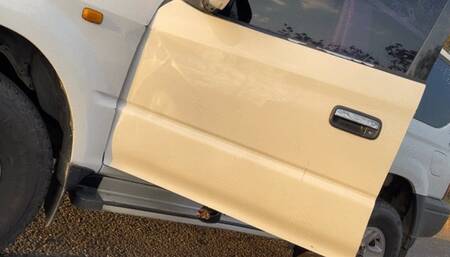 Balbina Leather Dominatrix on high heels in her Toyota Prado