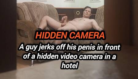 A Guy Jerks off His Dick in Front of a Video Camera in a Hotel