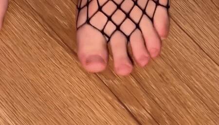 Feet in fishnets