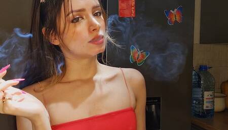 Teasing you while blowing smoke into your face, since you cant have a ciggie of your own ;) Muaa xx