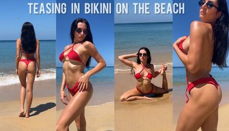Teasing in bikini on the beach