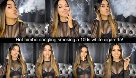 Hot bimbo dangling smoking a 100s white cigarette!