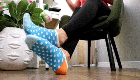 Feet play in blue socks