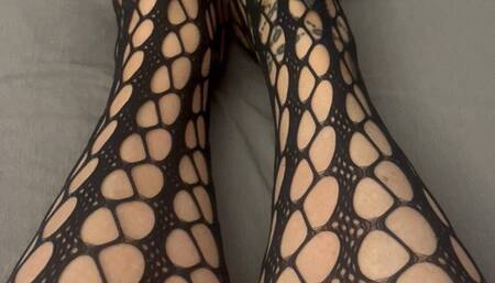 Pretty feet in fishnets