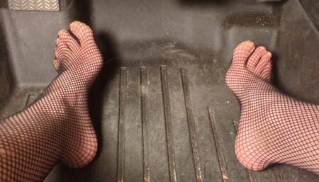 Fifi pedal pumping in sedan wearing fishnets