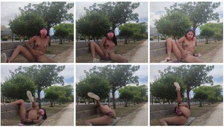 Cute skinny Latina, naked, masturbation with dildo, on a park seat