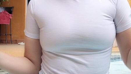 Smoking 100s wet t-shirt by the pool in the rain