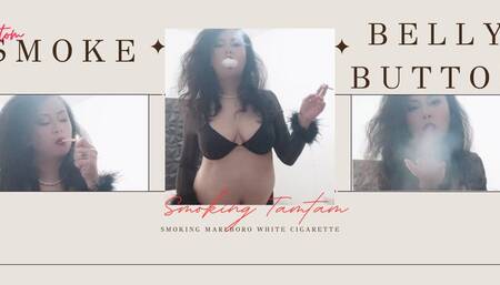 Flying smokey kiss showing belly and belly button in seethru longsleeve bra smoking Marlboro White cigarette