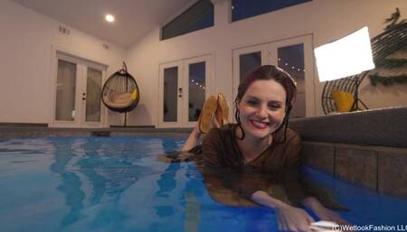 Petra swims with YOU wearing a long skirt and a brown top