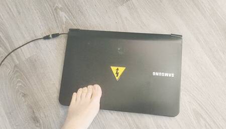 Affectionately Crushing a laptop