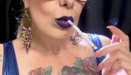 Chesterfield 100s - Dangling, Mouth Inhales and open mouth exhales, Deep Inhales, Nose exhales, Smoke rings, Coughing - Leather clothing, Heavy makeup, Purple lipstick, Long nails