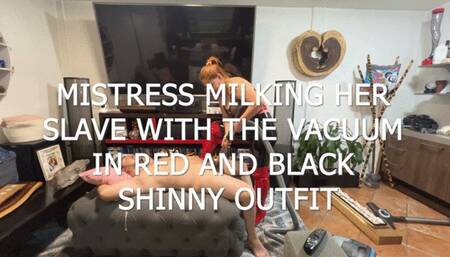 MISTRESS MILKING HER SLAVE WITH THE VACUUM IN RED AND BLACK SHINNY LEATHER POV 1