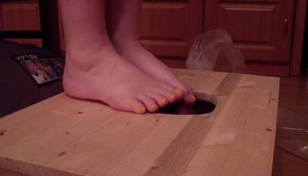 Trampling the air cushions on the slave's face with nylon socks and bare feet