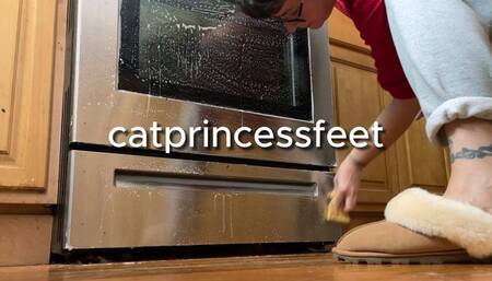 Housewife in furry slippers and sweatpants cleaning oven, size 9 milf