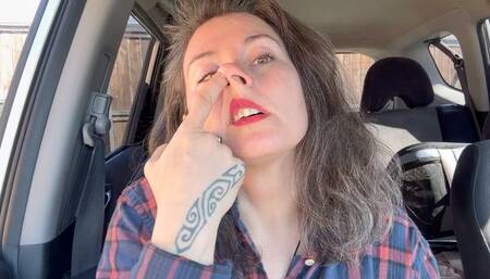 cleaning nose in the car