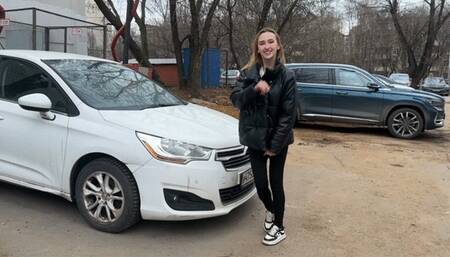 girl rocks the car suspension and the car shakes