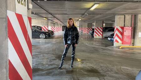 girl in high-heeled leather boots likes to press the pedals in cars, changes two cars and presses the pedals in them with a dash