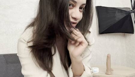 Hot brunette playing with dirty feet and toy