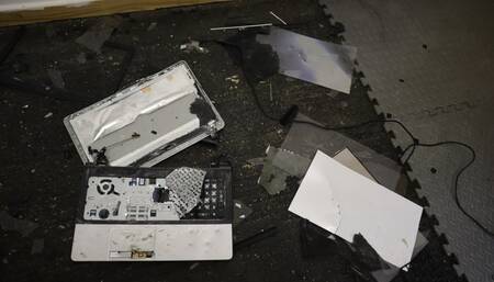 Laptop crush with black metal tipped stiletto high heels