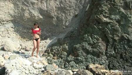 Naked girl masturbates on nude beach