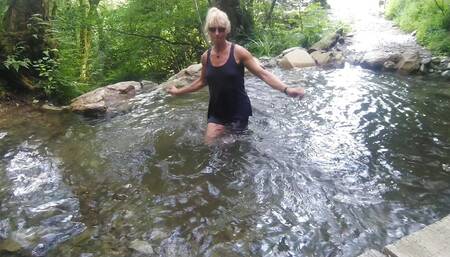 Alexa Cosmic Trans Girl Swimming in Font Near Waterfall Wearing Shorts and T-shirt...