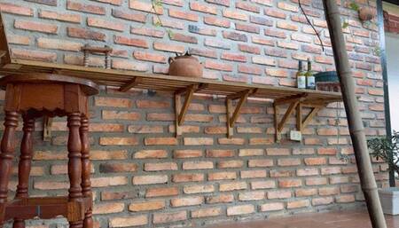 a cigarette before practice with his whip