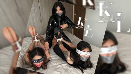 2 Hogtied Girls for Catsuited Simona (Tight Dress, Underwear, Catsuit, BallGag, TapeGag, Caress, Rope Bondage, Bandana Blindfolds, Barefoot, High Heels)