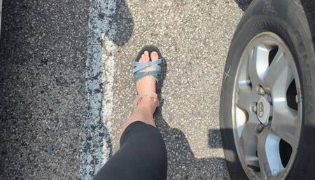 Fifi driving home from yoga in Teva sandals and leggings
