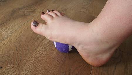 Tennis ball and bbw's foot