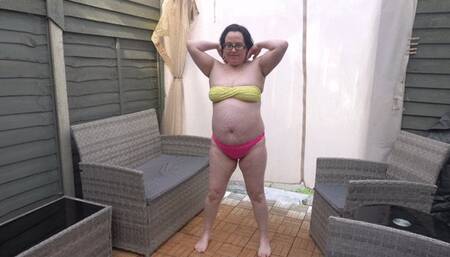 Raven hair wife stripping in yellow and pink bikinid