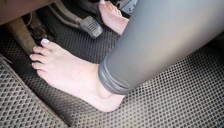 Hot Hottie pedal pumping minivan, high heels and bare feet