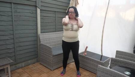 stripping playing with 10 inch Dildo on garden bench