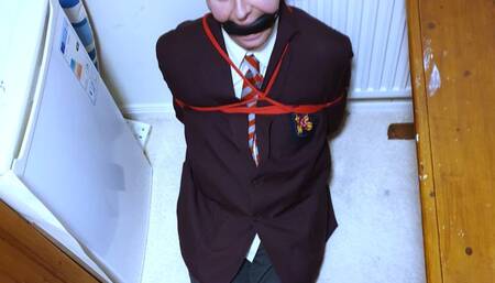 Making  bound and gagged man in adult school Uluniform pee in a bottle