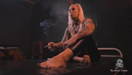 Smoking barefoot on pvc bed 4K MP4