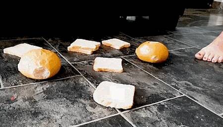 I prepare my slave's lunch under my dirty bare feet