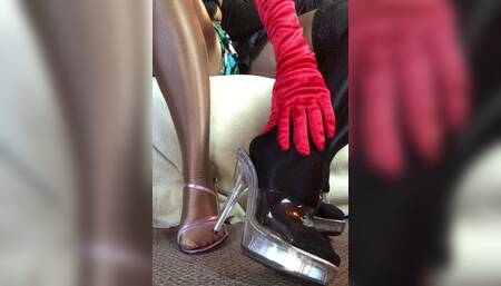 Sensual Teasing Close up Legs and Feet in Shiny Glossy Pantyhose and High Heels.